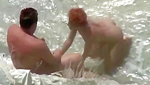Sex on the beach. Mature couple. She s in love with