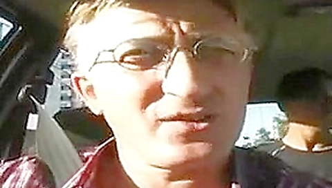 Husband observes wife with sum migrants